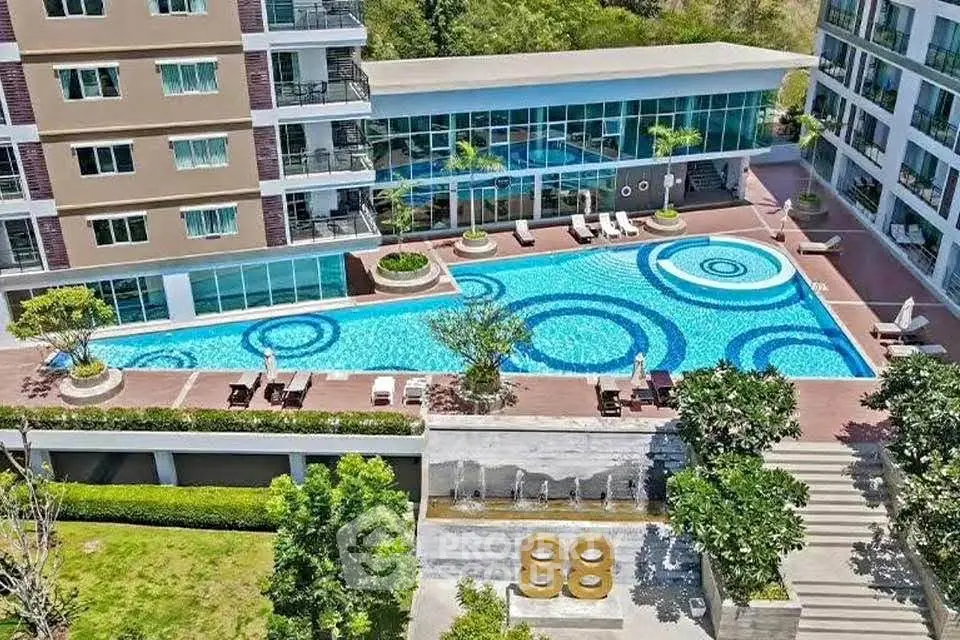 Luxurious apartment complex with stunning pool and modern amenities.
