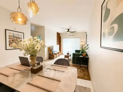 Stylish open-plan living and dining area with modern decor and natural light.