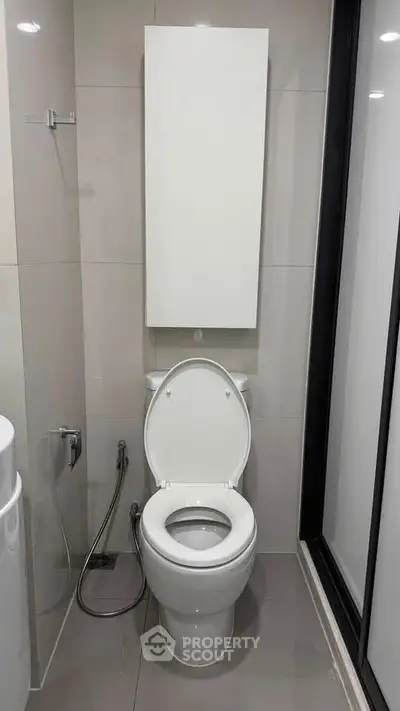 Modern bathroom with sleek toilet and contemporary design