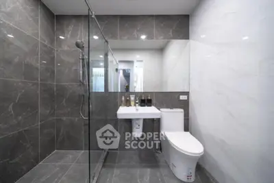 Modern bathroom with sleek design and glass shower enclosure