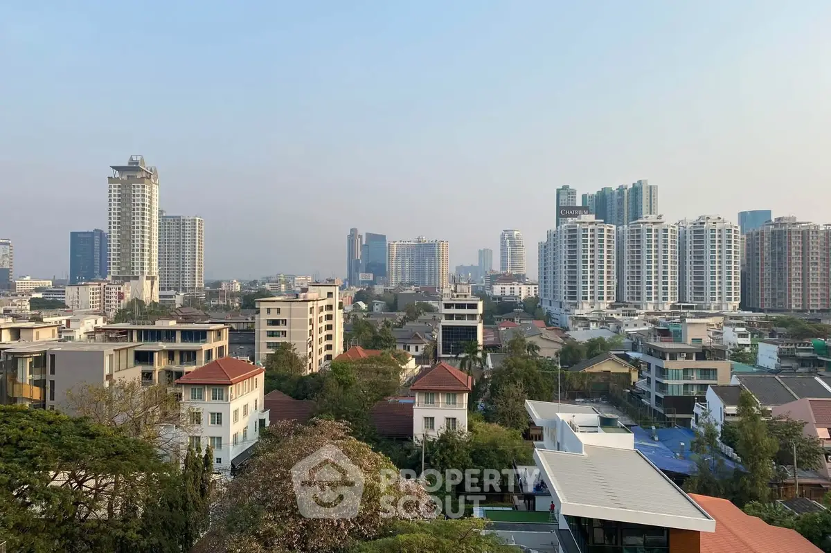 Stunning cityscape view showcasing modern high-rise buildings and lush greenery in a vibrant urban setting.