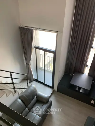 Modern loft apartment with high ceilings and large windows