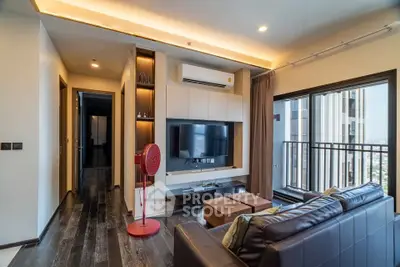 Modern living room with sleek design, large windows, and city view balcony in luxury apartment.