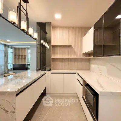 Modern kitchen with sleek marble countertops and open layout design