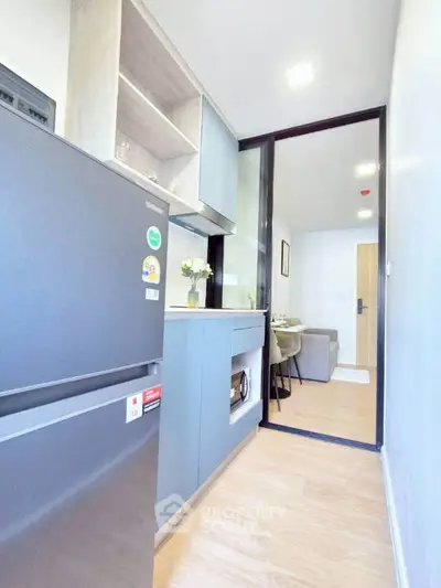 Modern kitchen with sleek appliances and open layout in a stylish apartment
