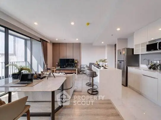 Spacious modern living room with open kitchen and stylish decor