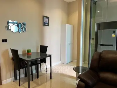 Modern living room with dining area and sleek kitchen appliances