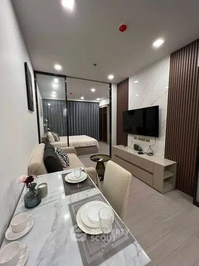 Modern open-plan living room with stylish decor and cozy dining area