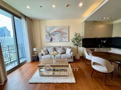 Elegant living room with modern decor and city view balcony in luxury apartment.