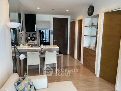 Modern apartment interior with open kitchen and cozy living area