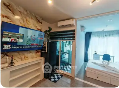 Modern apartment interior with stylish living room and cozy bedroom, featuring marble accent wall and large TV.