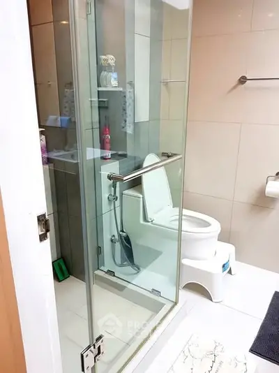 Modern bathroom with glass shower and sleek fixtures