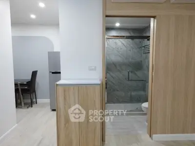 Modern apartment interior with sleek bathroom and dining area