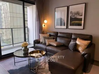 Stylish living room with leather sofa and city view balcony in modern apartment.