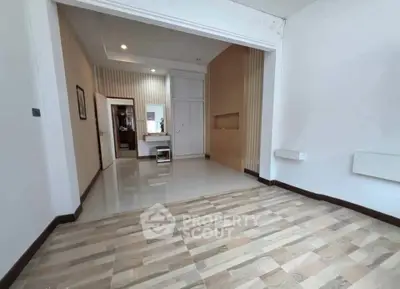 Spacious modern living room with stylish flooring and elegant wall design