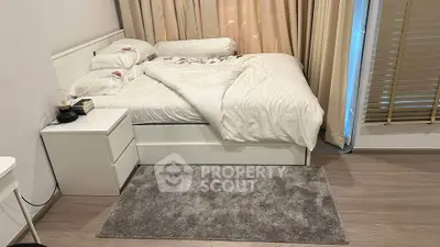 Cozy bedroom with modern white furniture and soft lighting