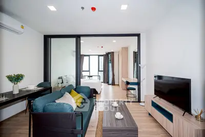 Modern open-plan living room with stylish furniture and natural light