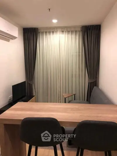 Cozy modern living room with stylish furniture and elegant curtains