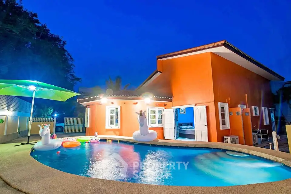 Stunning villa with private pool and vibrant exterior, perfect for luxurious living.