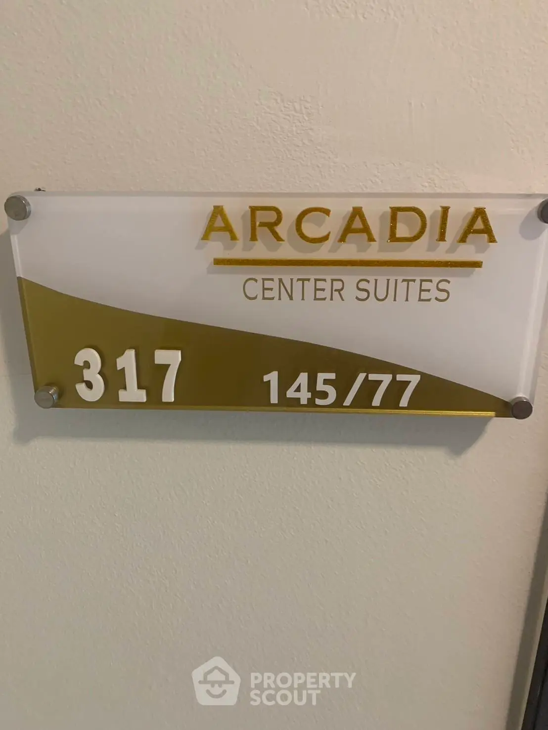 Arcadia Center Suites room number 317 sign on wall, indicating a specific suite location.
