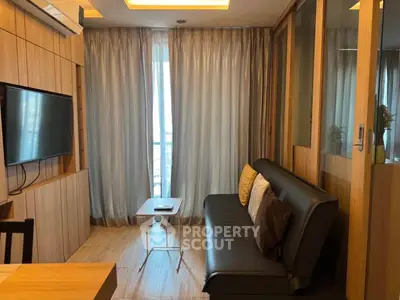 Modern living room with sleek furniture and floor-to-ceiling curtains, perfect for urban living.
