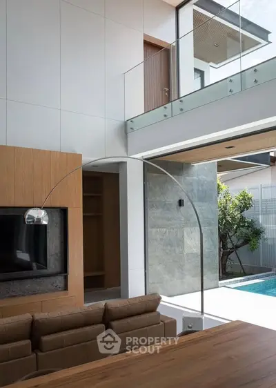 Luxurious modern living room with pool view and elegant design