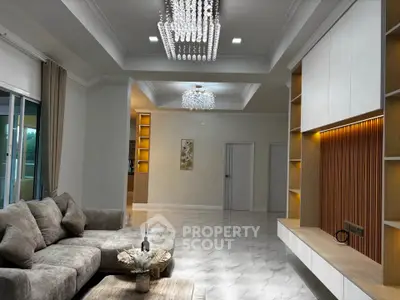Luxurious living room with elegant chandelier and modern decor