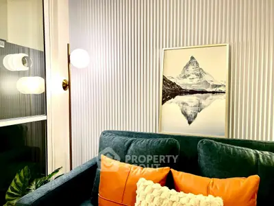 Stylish living room with modern decor and mountain artwork