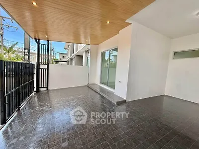 Spacious modern balcony with sleek tile flooring and wooden ceiling