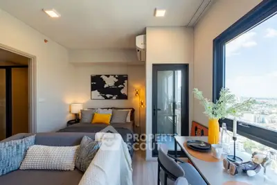 Modern studio apartment with stunning city view and stylish decor