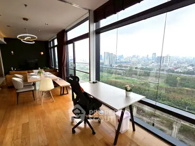 Spacious modern living room with panoramic city view and stylish furniture