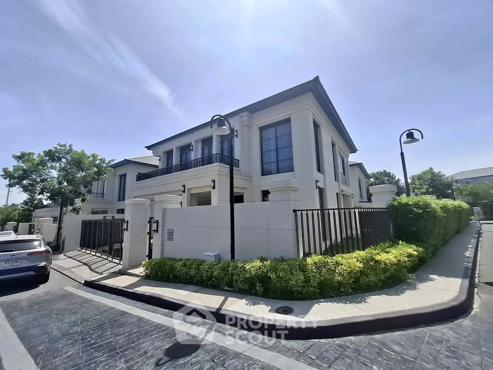 Luxurious modern villa with elegant architecture and lush greenery in a serene neighborhood.