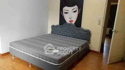 Stylish bedroom with modern bed and artistic wall decor