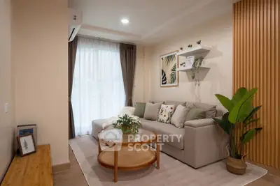 Stylish living room with modern decor, cozy sofa, and elegant wooden accents.