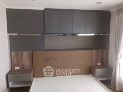 Modern bedroom with built-in storage and sleek design