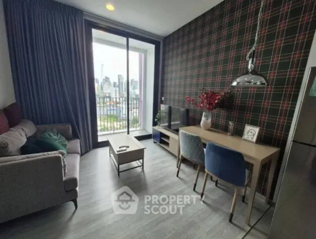 Modern living room with city view, stylish decor, and cozy seating area.