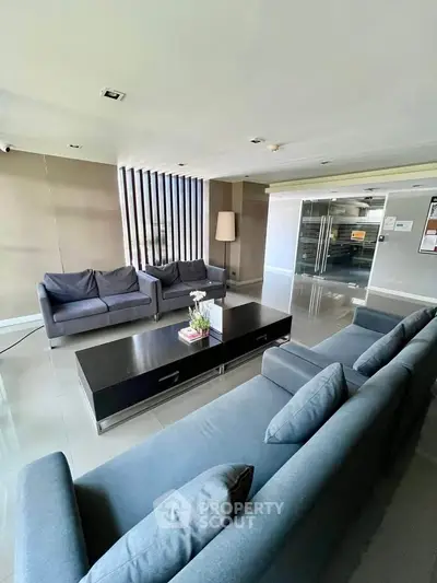 Modern living room with sleek furniture and natural light