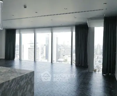 Luxurious high-rise apartment with panoramic city views and elegant marble flooring.