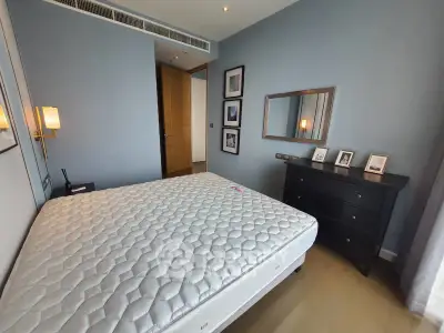 Modern bedroom with stylish decor and comfortable mattress in a contemporary apartment.
