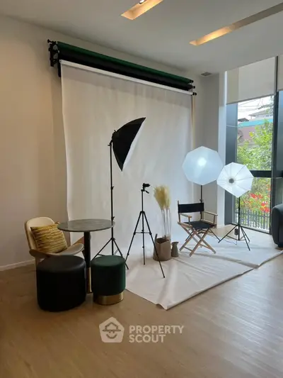 Modern photography studio setup with natural light and stylish decor
