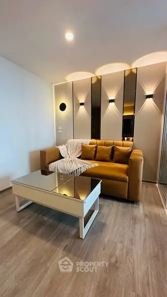 Modern living room with stylish decor and cozy sofa in a contemporary apartment.