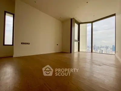 Spacious corner unit with stunning city view and large windows, perfect for modern living.
