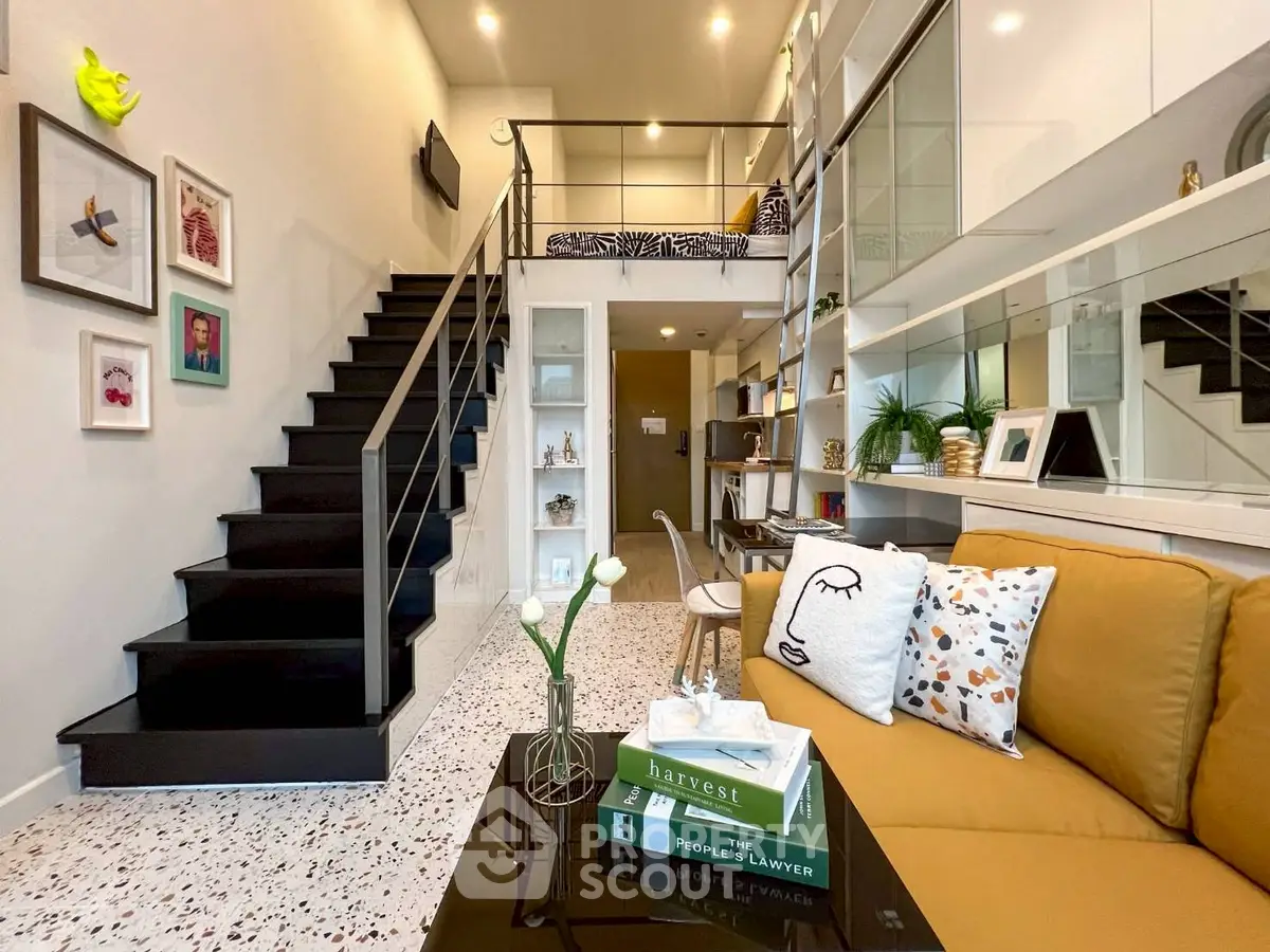 Stylish modern living room with mezzanine, cozy sofa, and decorative elements.