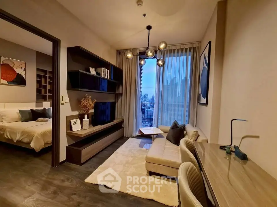 Modern living room with city view, stylish decor, and cozy seating area