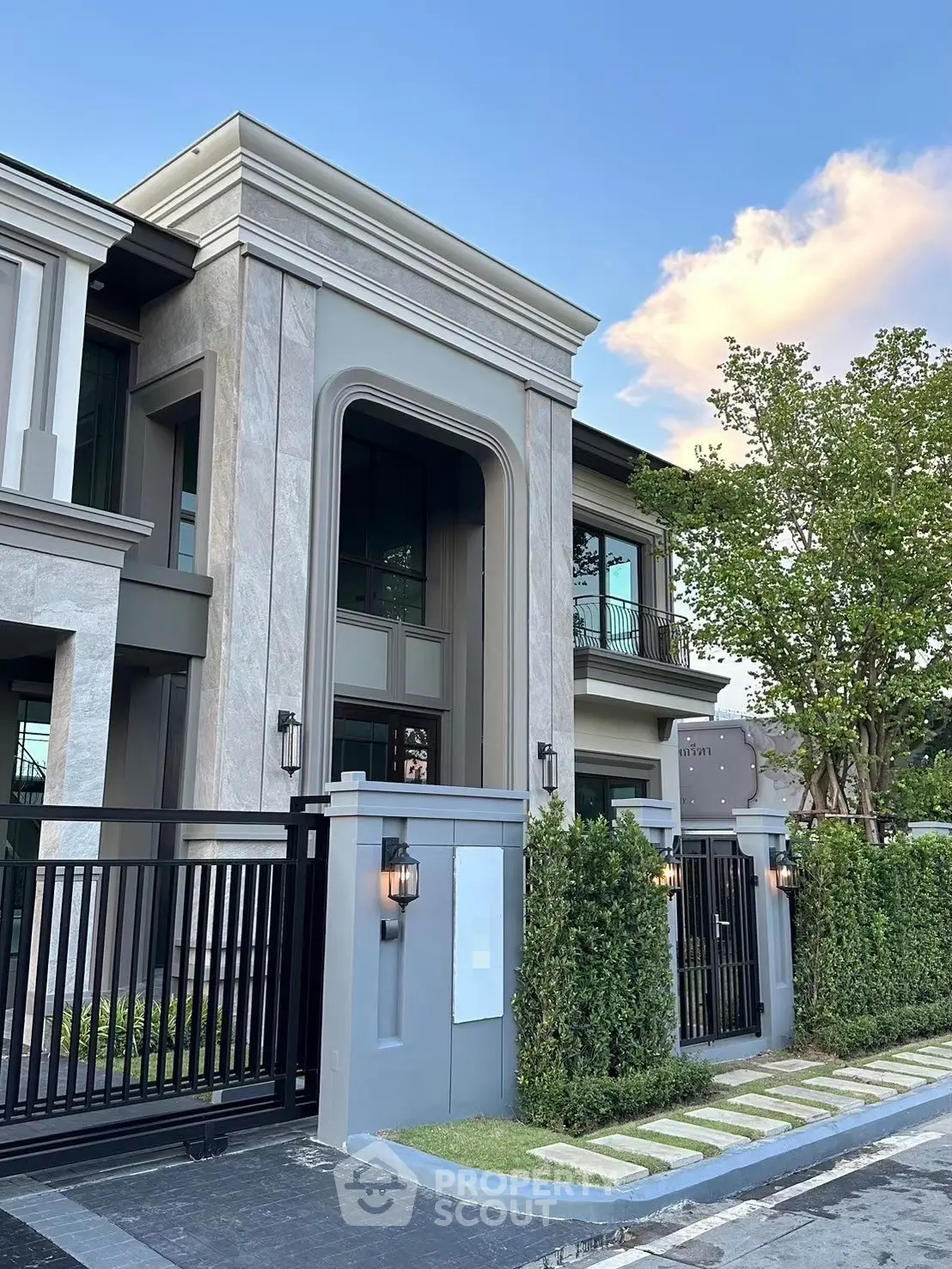 Luxurious modern house exterior with elegant design and lush greenery