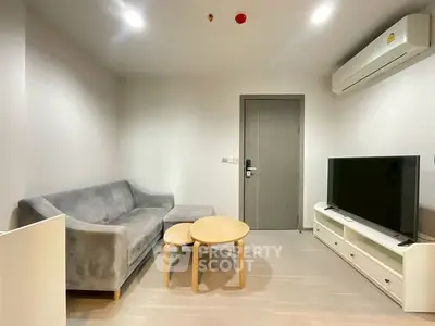 Modern living room with sleek furniture and air conditioning