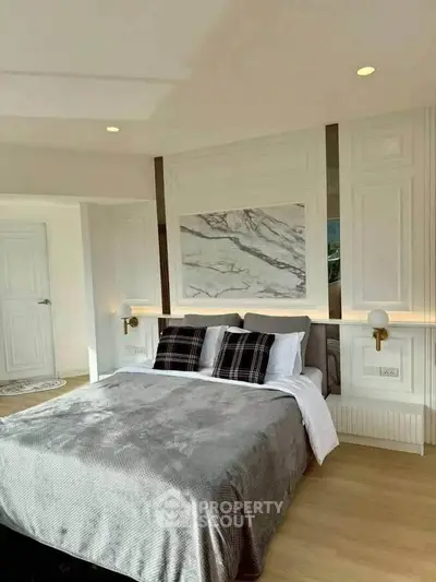 Luxurious bedroom with elegant marble accent wall and modern decor