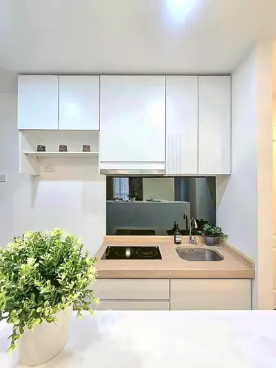 Modern kitchen with sleek white cabinets and built-in electric stove