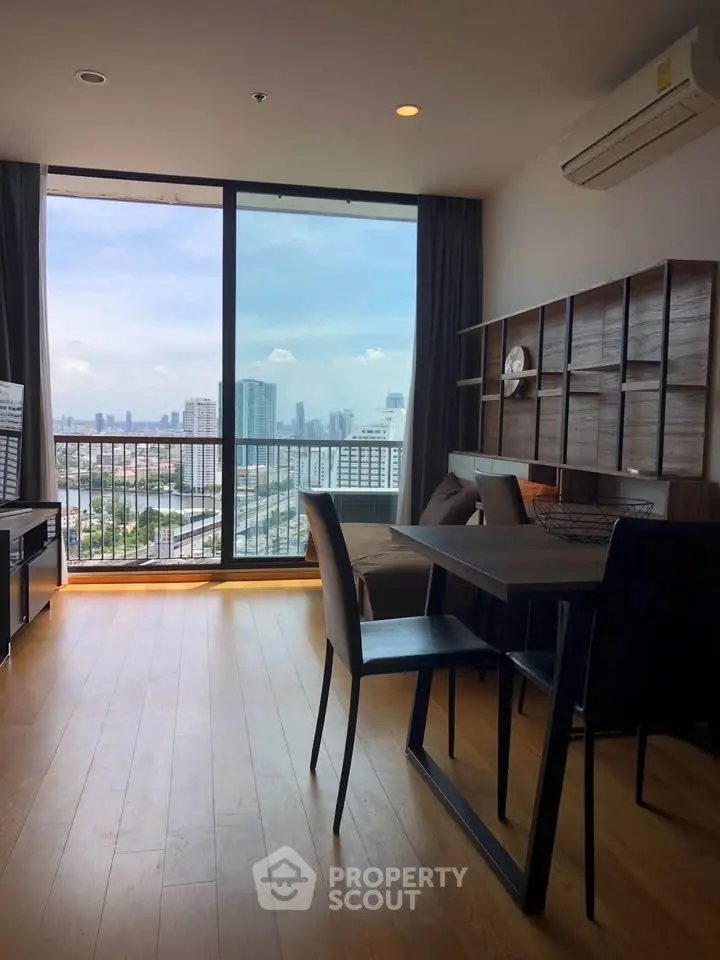 Modern living room with city view and stylish furniture in high-rise apartment
