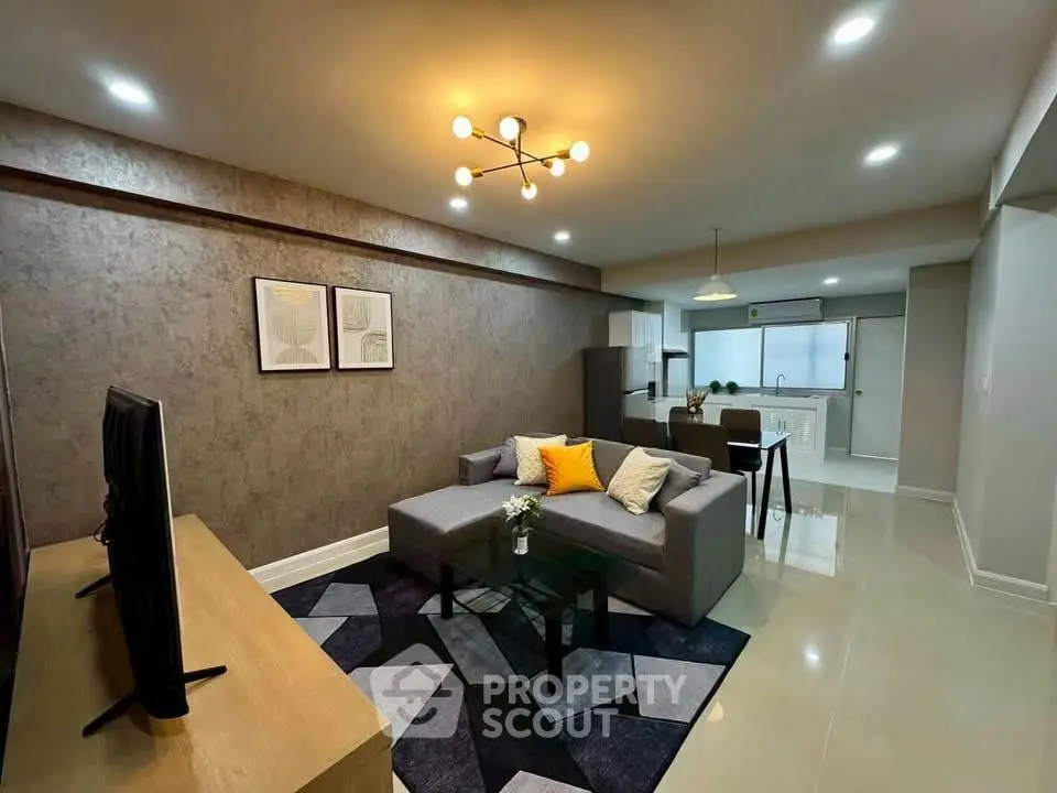 Spacious modern living room with stylish decor and open kitchen layout